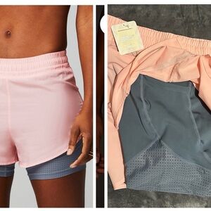NWT. Fabletics Pink and Gray Athletic Perforated run  5”Shorts